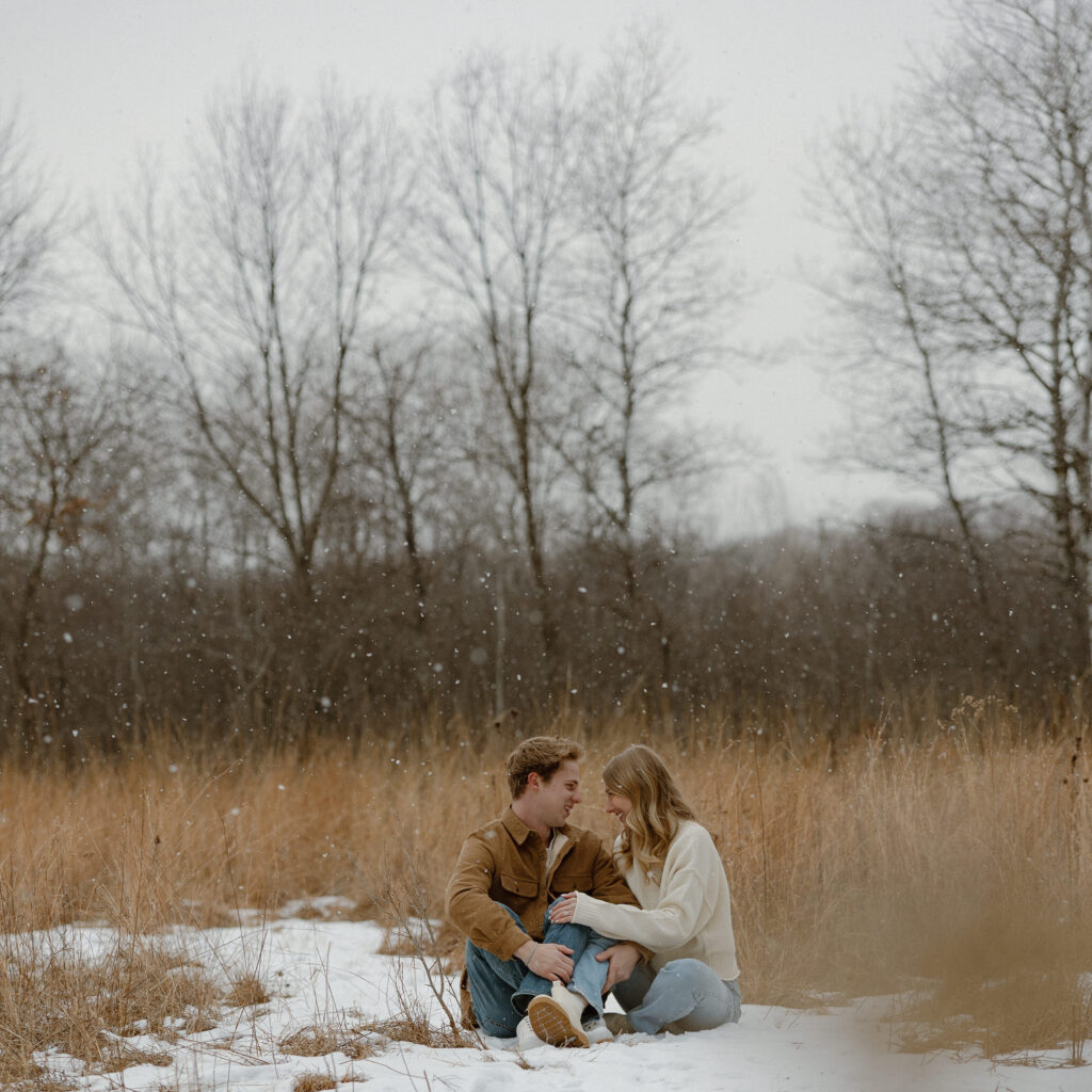 Couple taking engagement winter photos in Minnesota