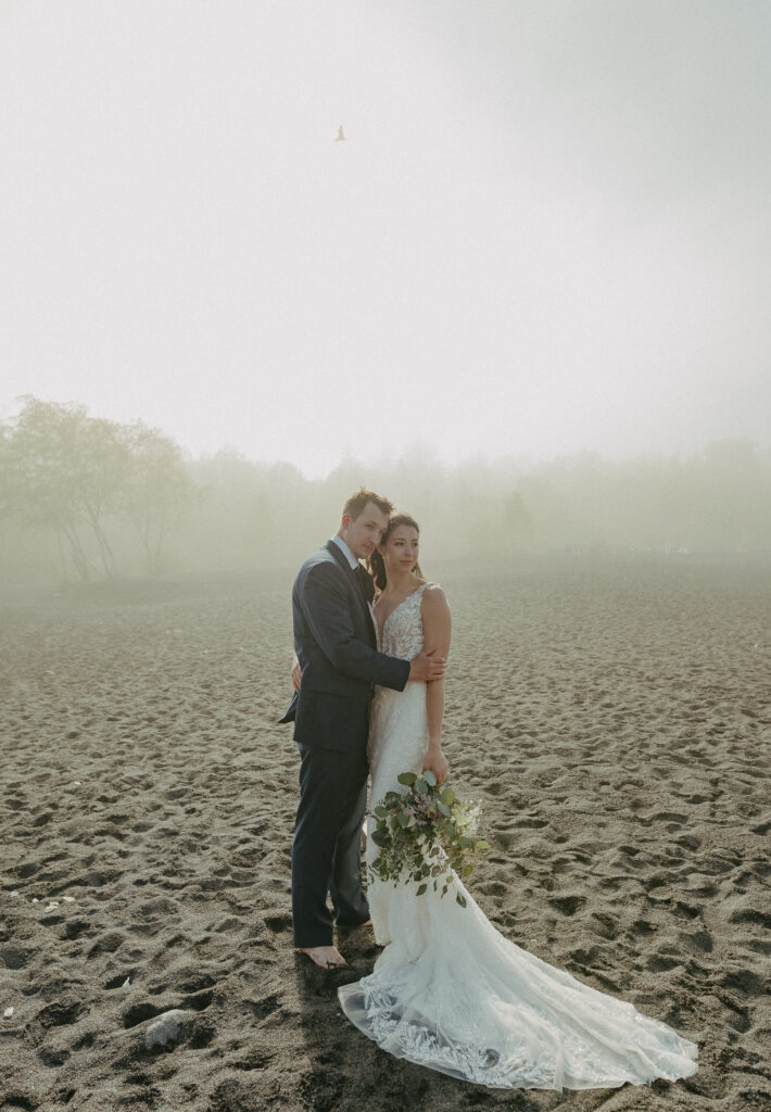 A couple eloping on Black Beach along the North Shore of Minnesota