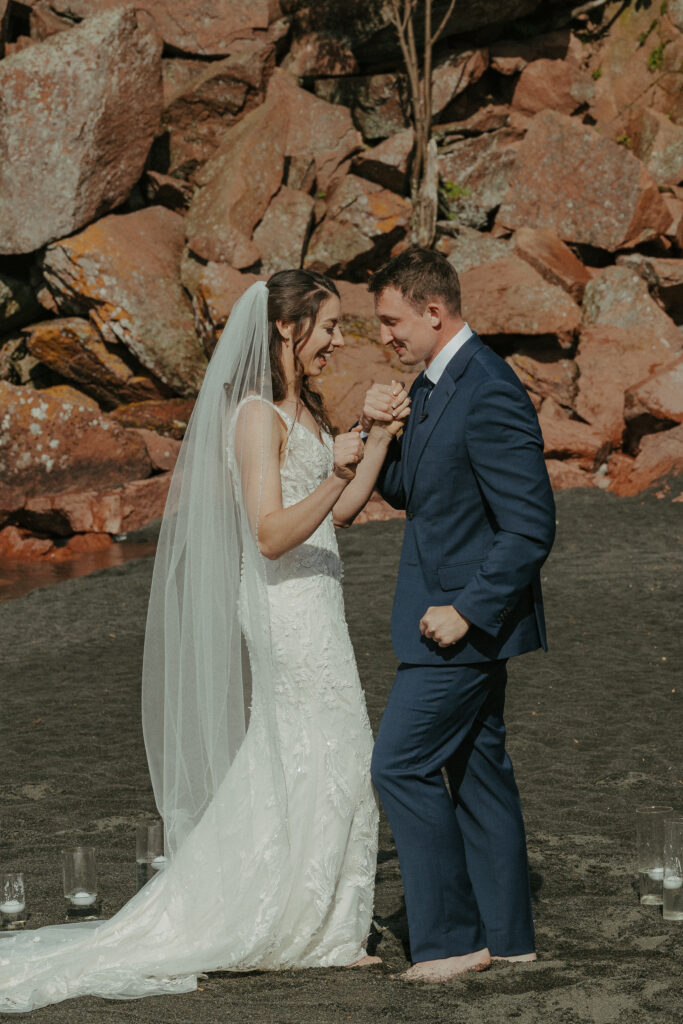 A couple eloping on Black Beach along the North Shore of Minnesota
