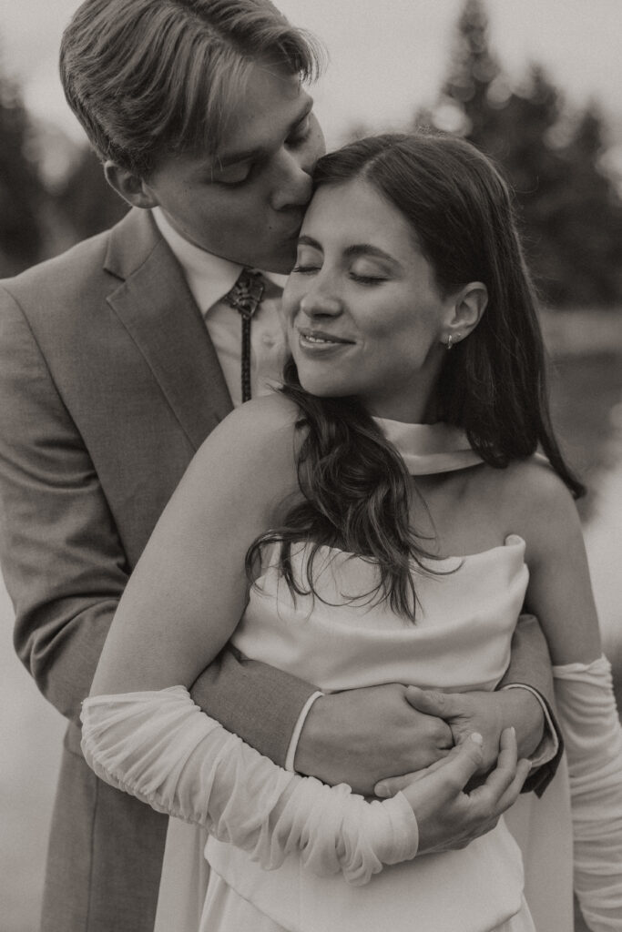 A couple eloping at sunrise at Schwabacher Landing in Grand Teton National Park