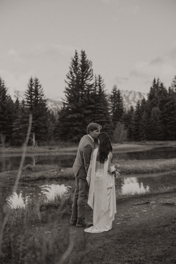 A couple eloping at sunrise at Schwabacher Landing in Grand Teton National Park
