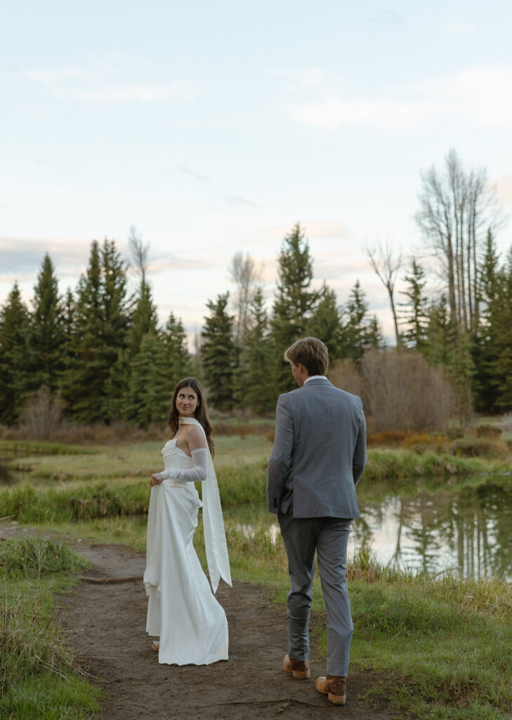 A couple eloping at sunrise at Schwabacher Landing in Grand Teton National Park