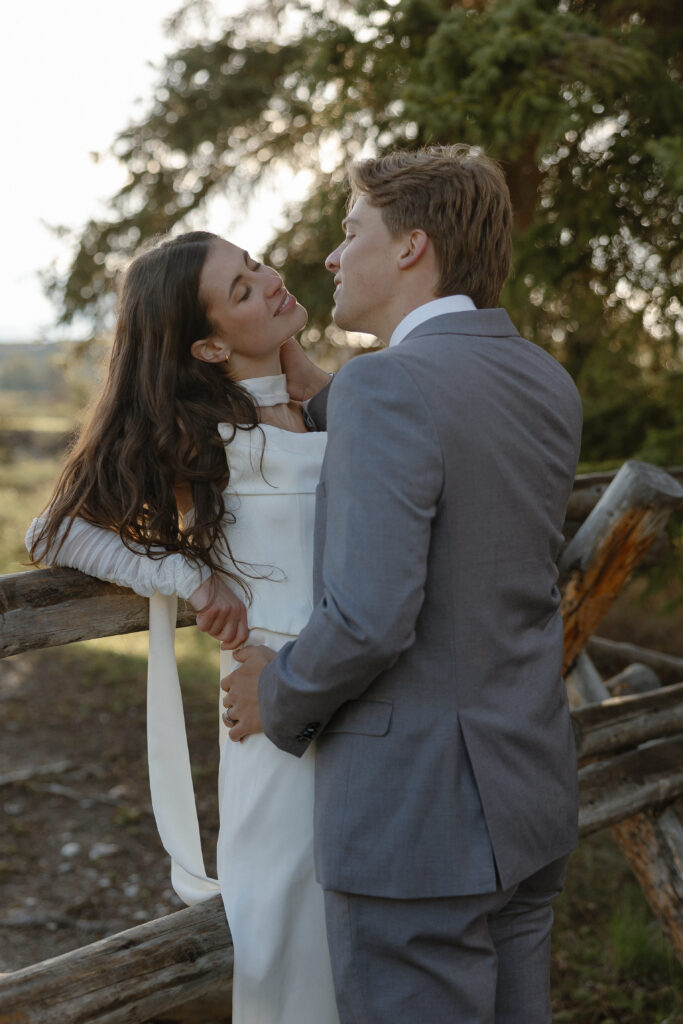 A couple eloping at sunrise at Schwabacher Landing in Grand Teton National Park