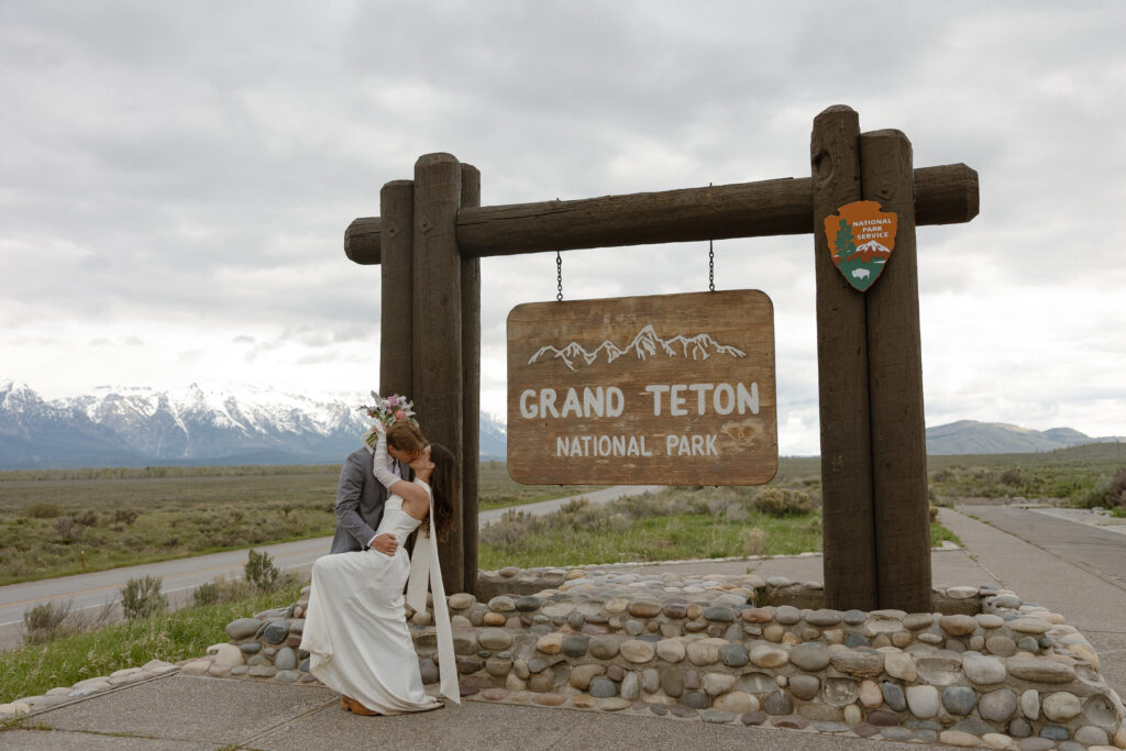 A couple eloping at sunrise at Schwabacher Landing in Grand Teton National Park