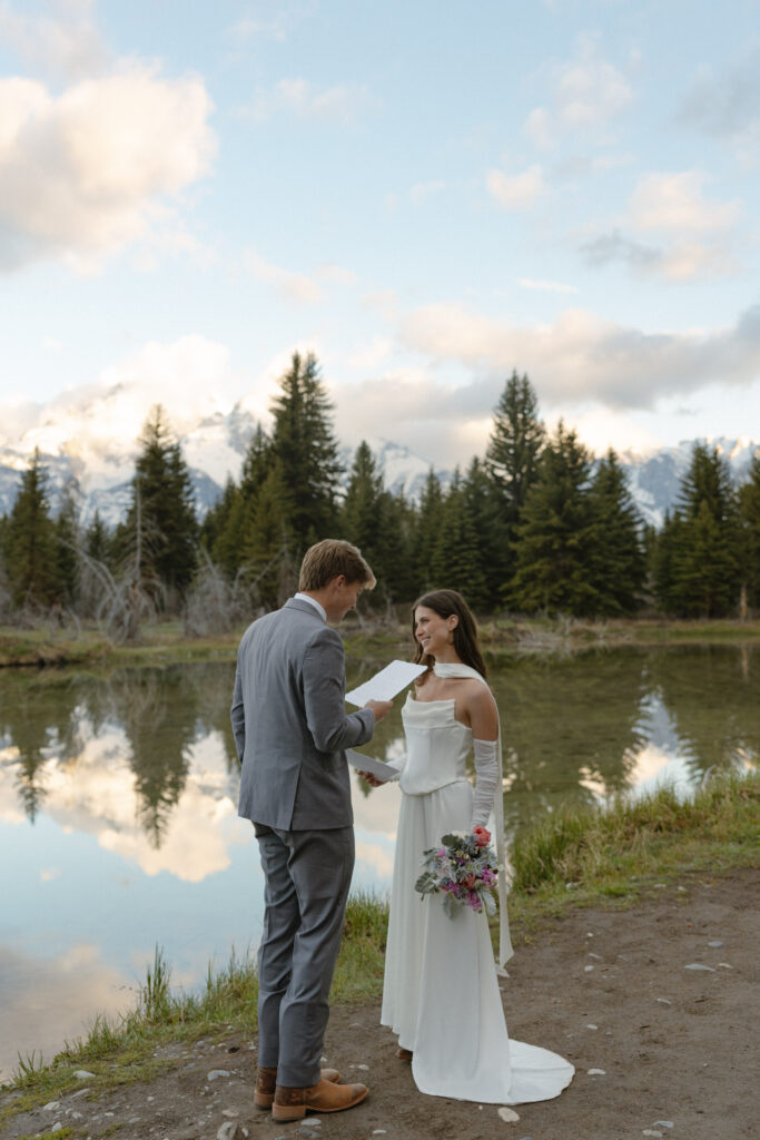 A couple eloping at sunrise at Schwabacher Landing in Grand Teton National Park