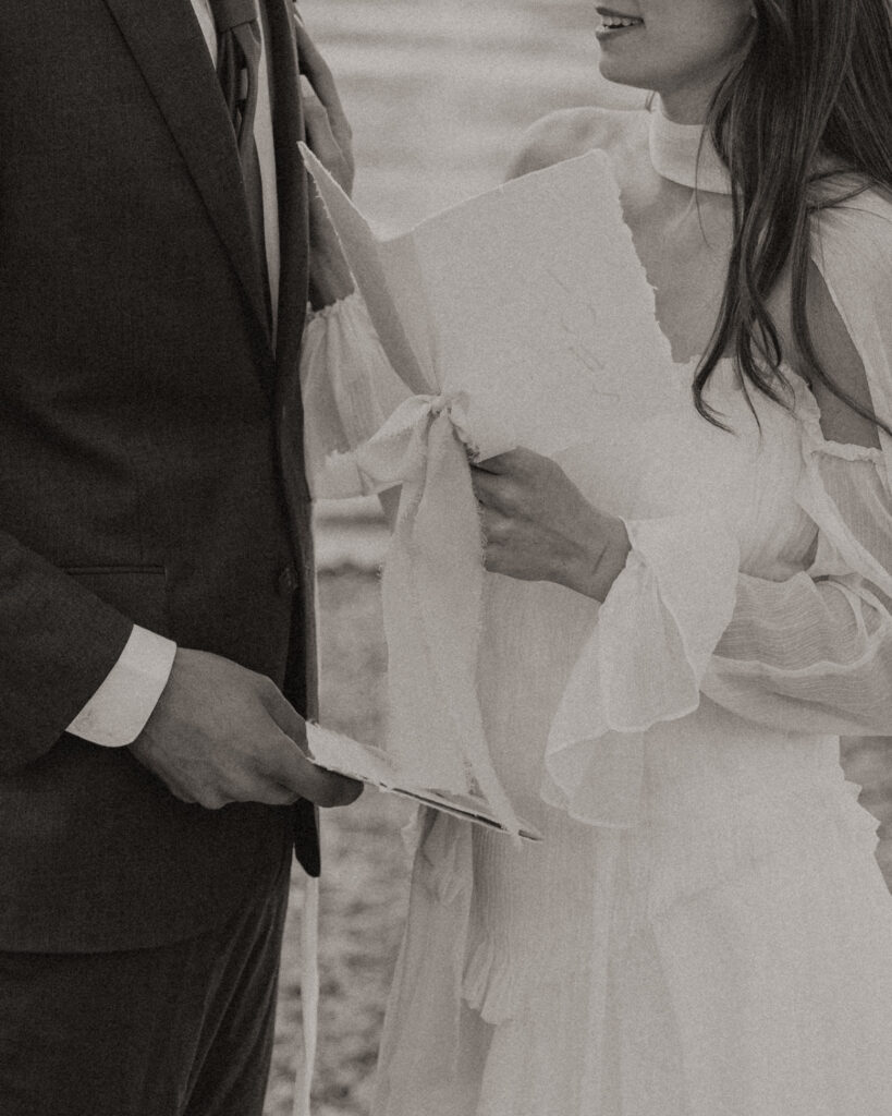 Bride and groom embracing during a moody Colter Bay elopement in Grand Teton National Park