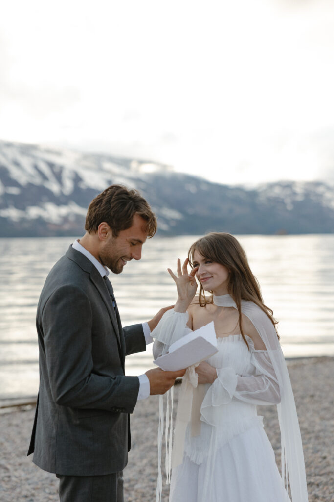Bride and groom embracing during a moody Colter Bay elopement in Grand Teton National Park