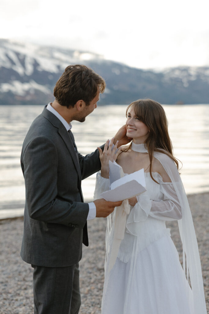 Bride and groom embracing during a moody Colter Bay elopement in Grand Teton National Park