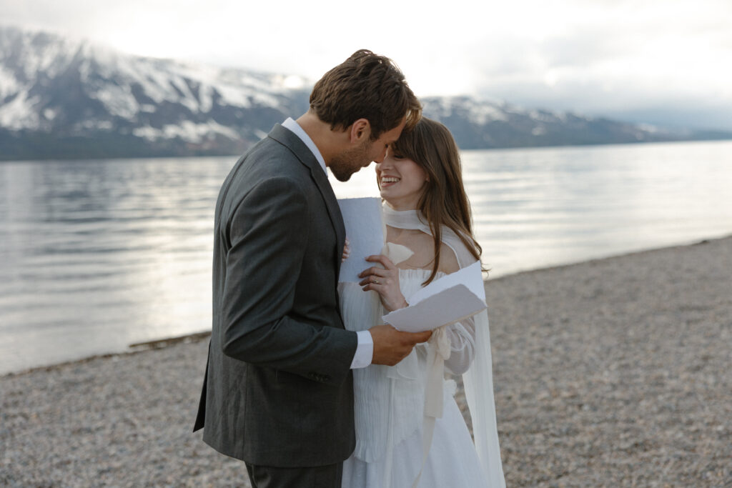 Bride and groom embracing during a moody Colter Bay elopement in Grand Teton National Park