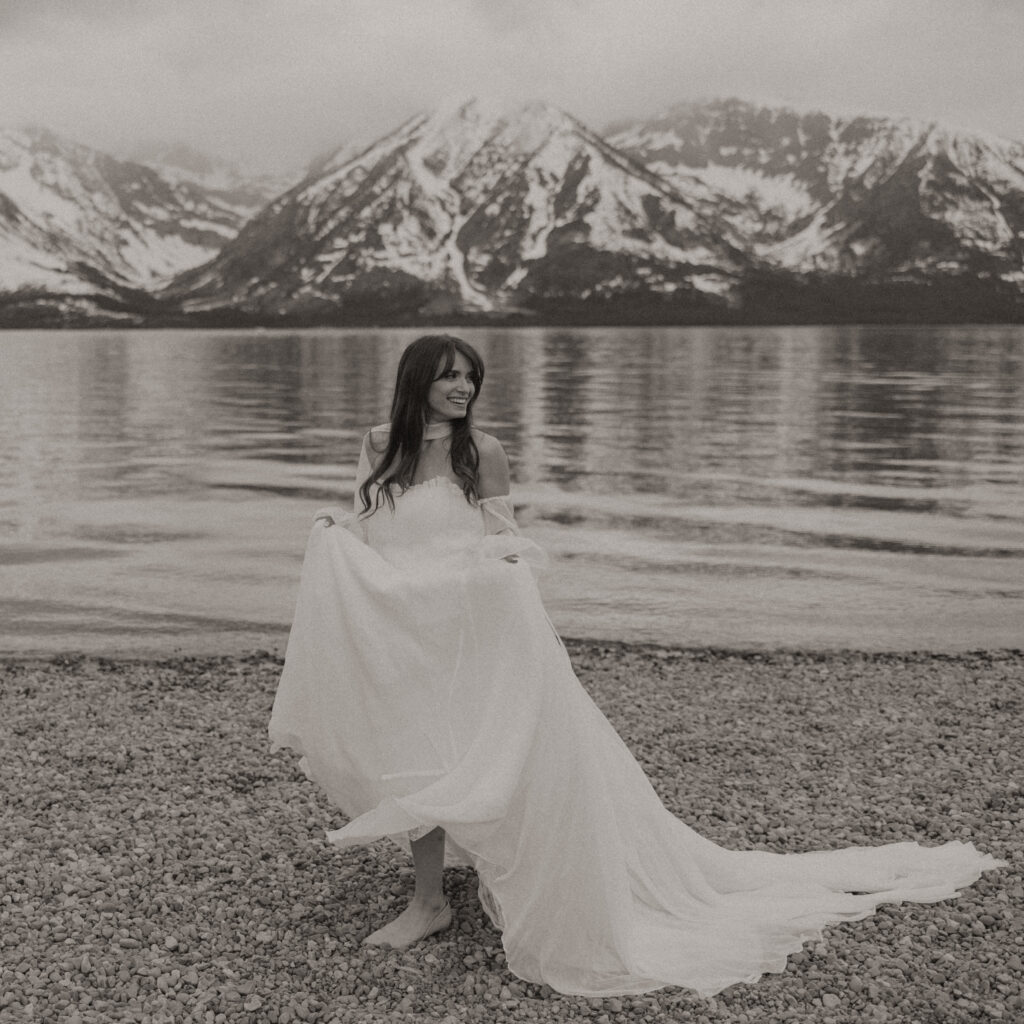 Bride and groom embracing during a moody Colter Bay elopement in Grand Teton National Park