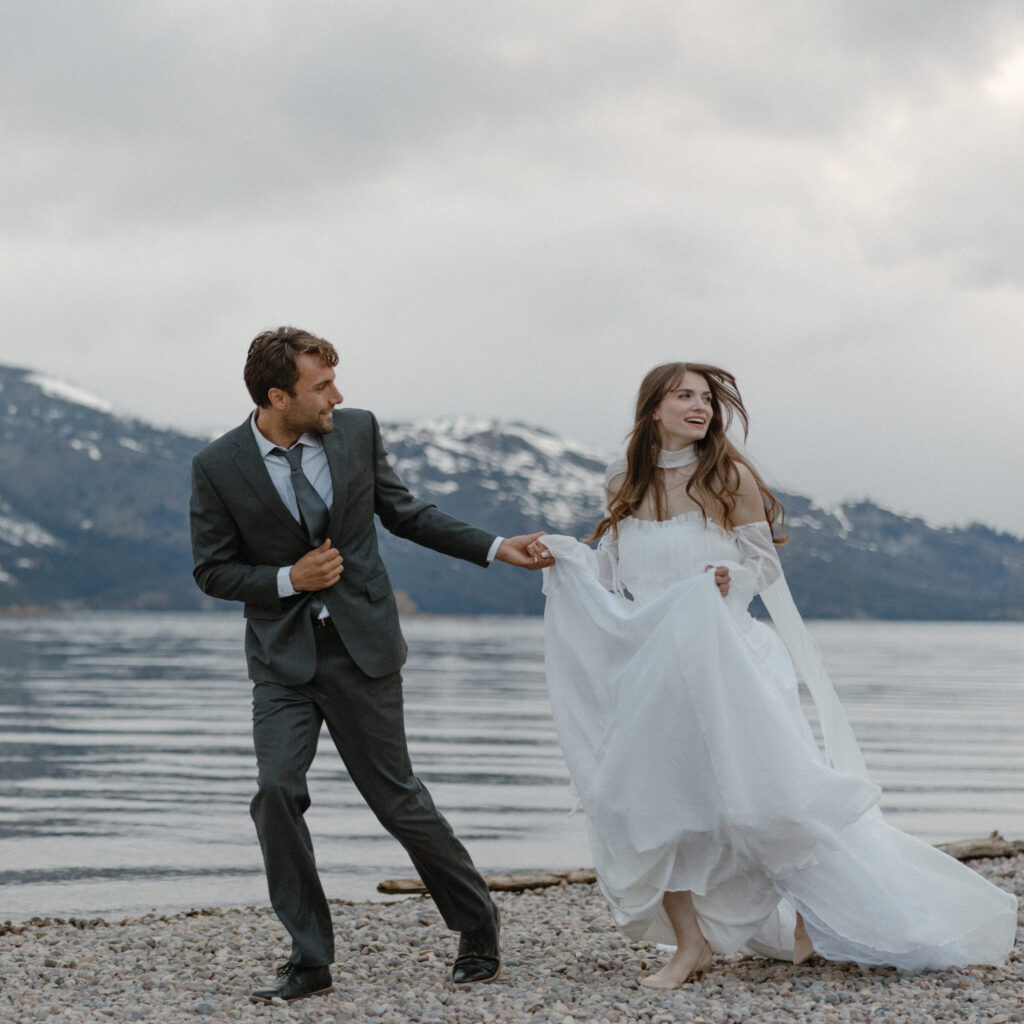 Bride and groom embracing during a moody Colter Bay elopement in Grand Teton National Park