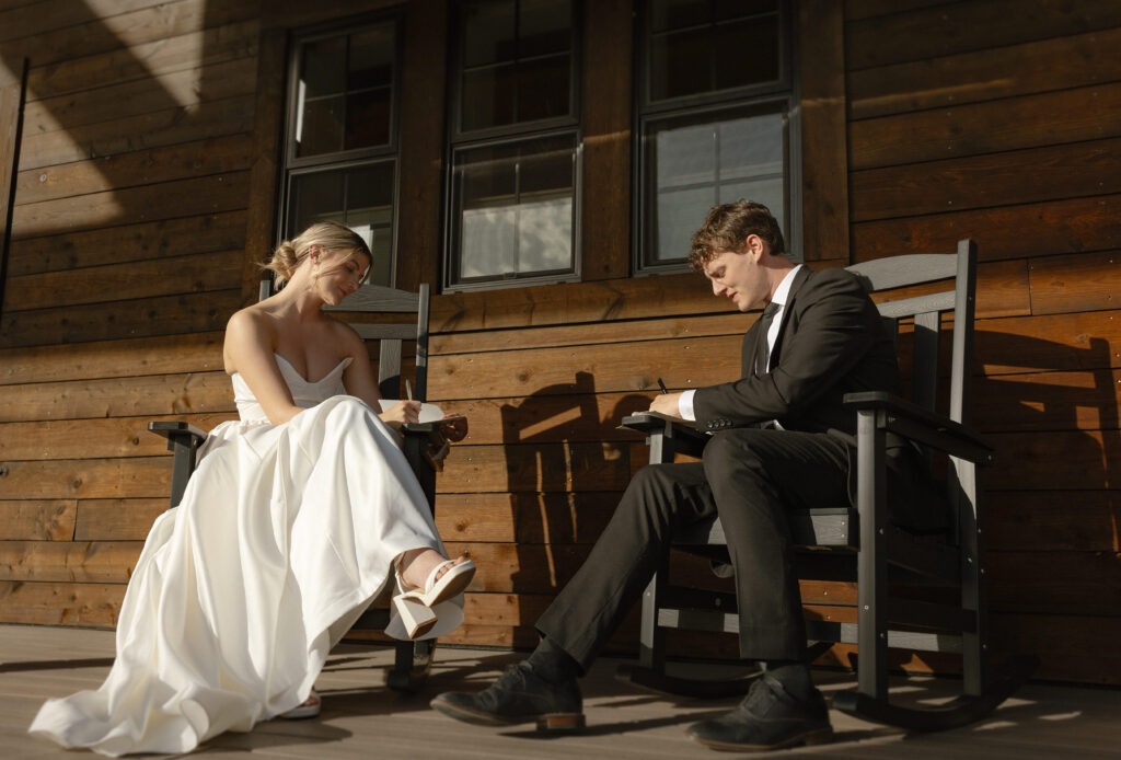 Couple seated together on the porch during a private ranch elopement in Wyoming