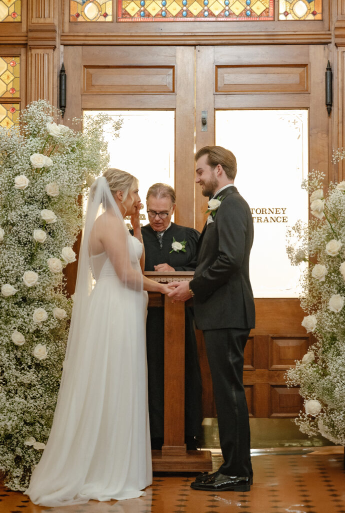 Couple exchanging vows during an intimate luxury Ohio city hall wedding in Findlay