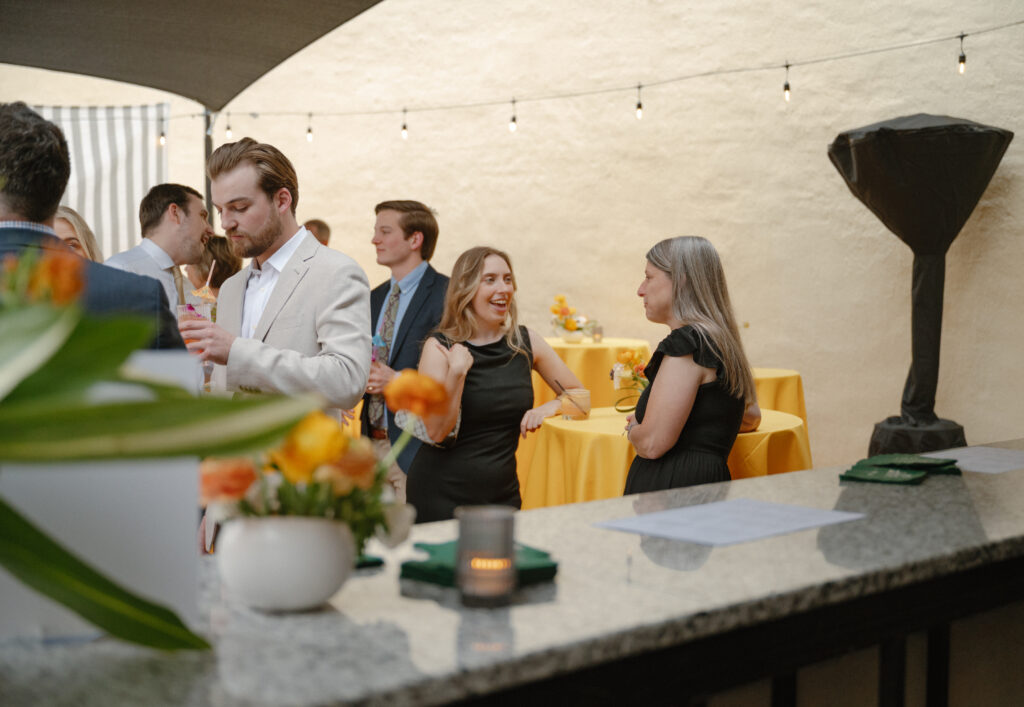Guests celebrating together at a colorful wedding welcome party