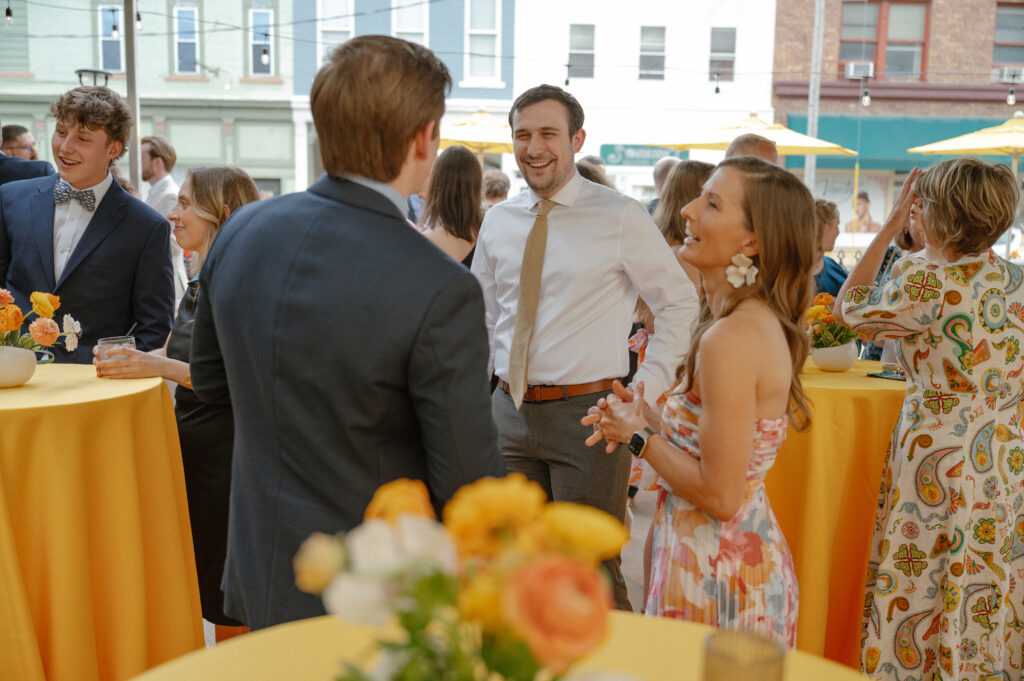 Guests celebrating together at a colorful wedding welcome party