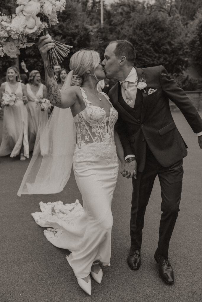 Newlyweds walking down the aisle at their Hutton House wedding