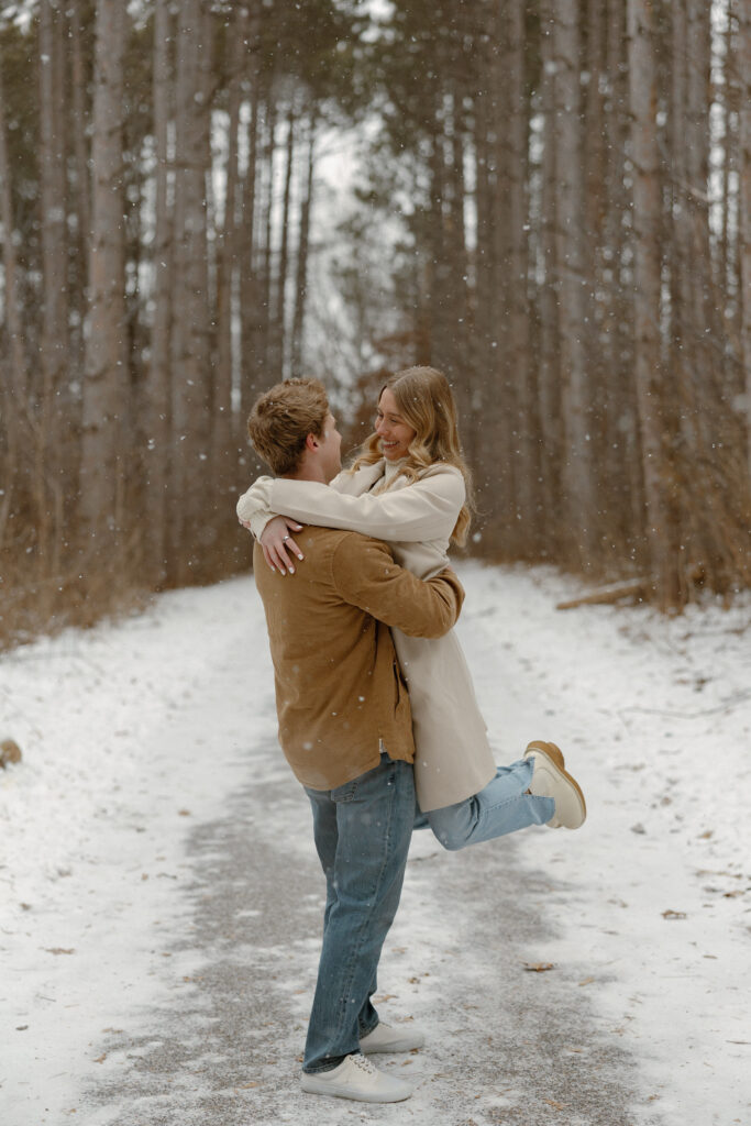 Snow falling during a Minnesota winter engagement photo session