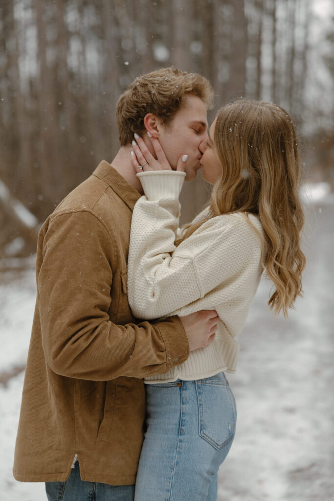Snow falling during a Minnesota winter engagement photo session