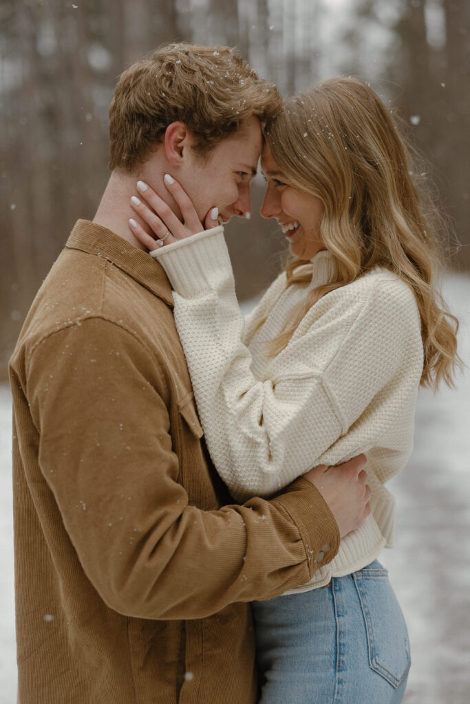 Snow falling during a Minnesota winter engagement photo session