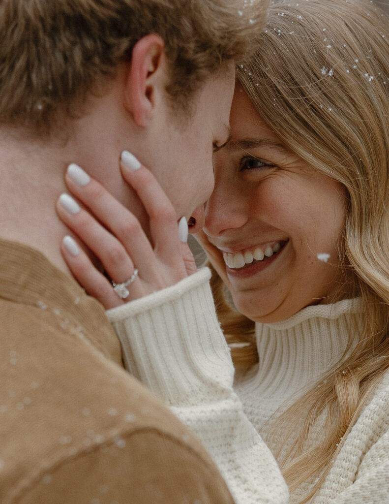 Snow falling during a Minnesota winter engagement photo session