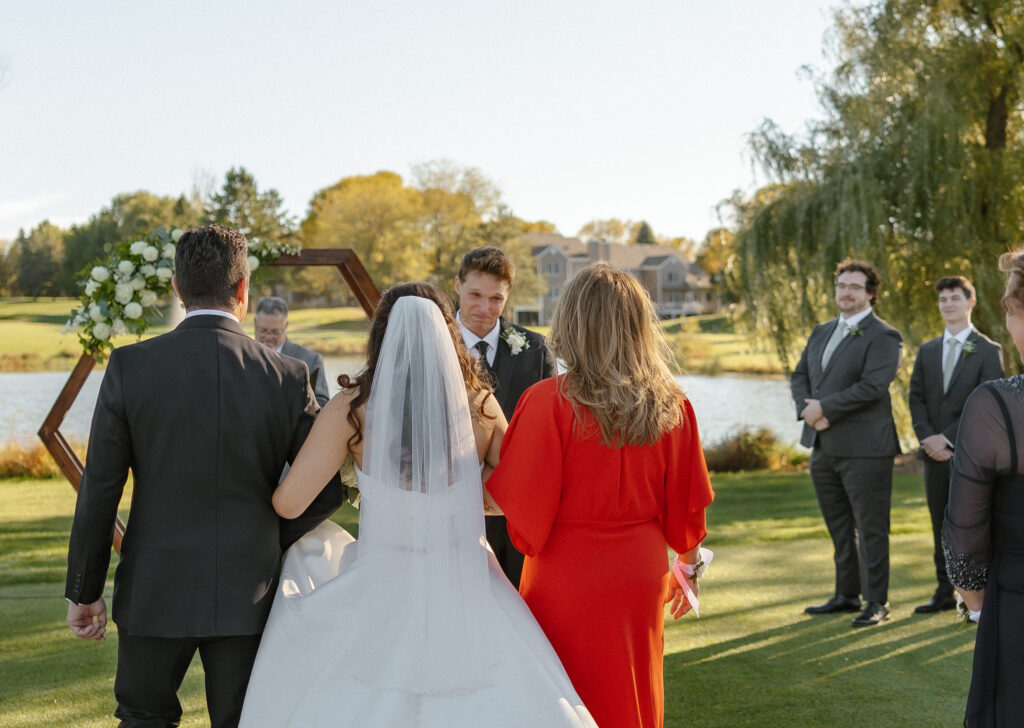 Bride walking down aisle at Oak Glen Golf Course wedding