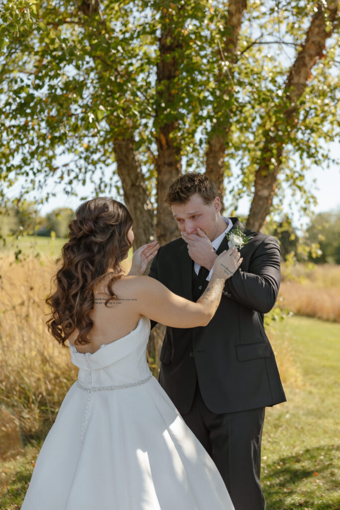 Emotional first look at Oak Glen Golf Course wedding in Stillwater MN