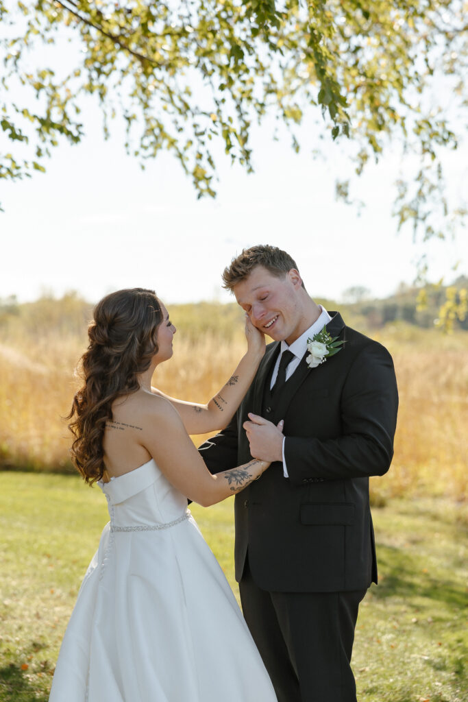 Emotional first look at Oak Glen Golf Course wedding in Stillwater MN
