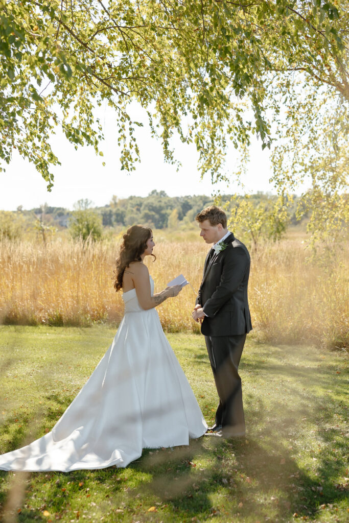 Emotional first look at Oak Glen Golf Course wedding in Stillwater MN