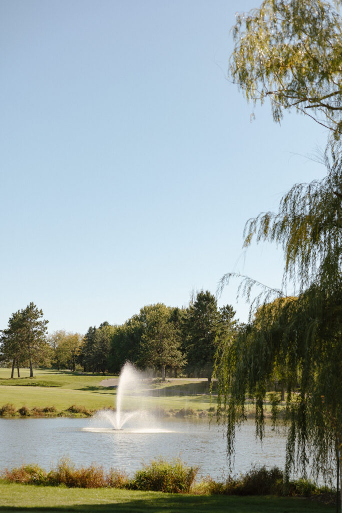 Outdoor waterfront ceremony at Oak Glen Golf Course wedding Stillwater MN