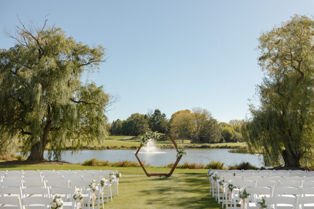 Outdoor waterfront ceremony at Oak Glen Golf Course wedding Stillwater MN
