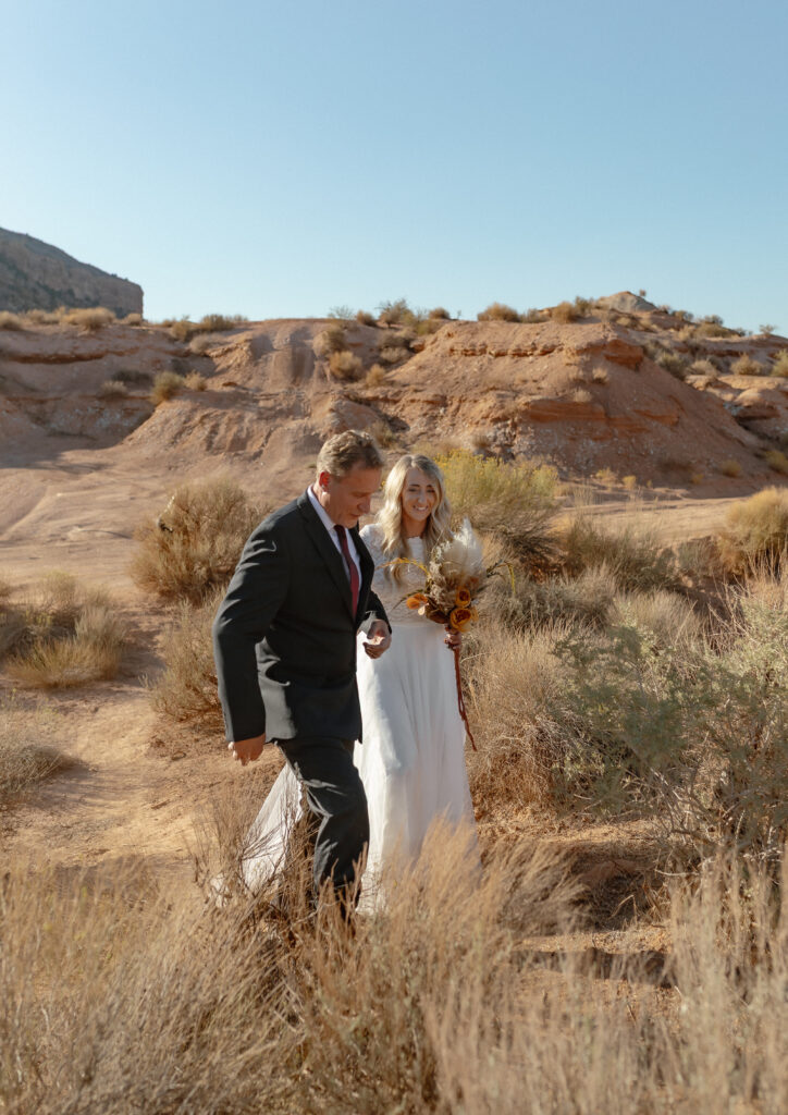 Bride being walked down during her intimate Zion National Park elopement