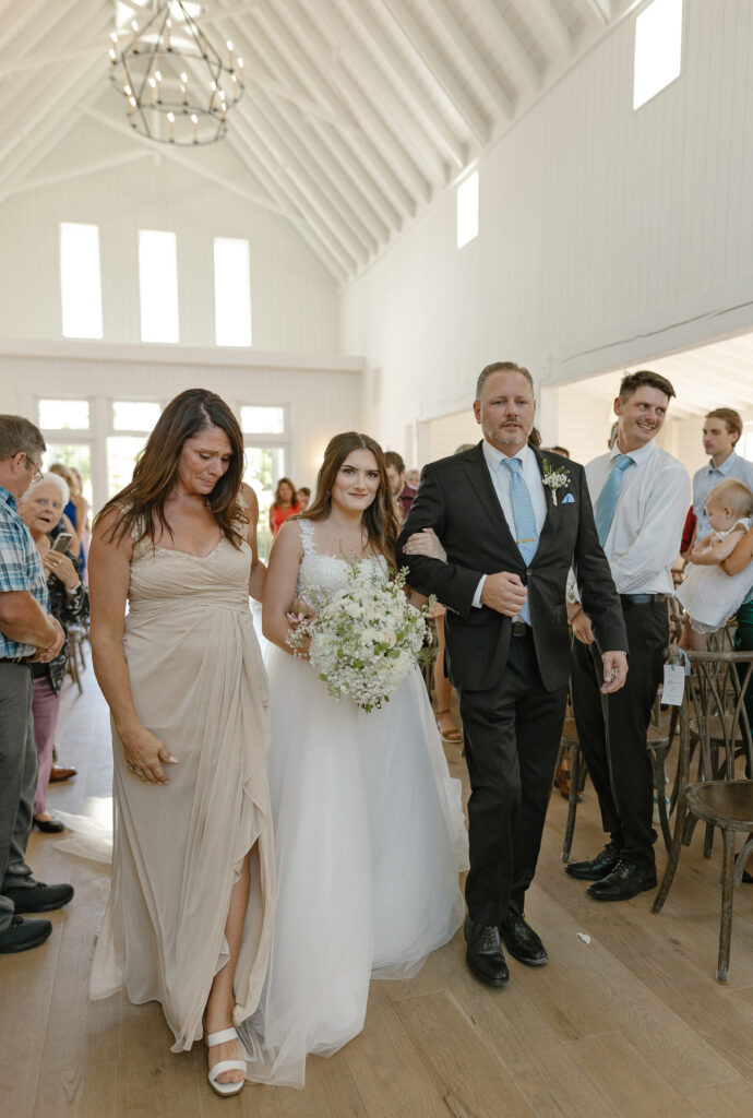 Married couple celebrating their romantic summer wedding at Redeemed Farm