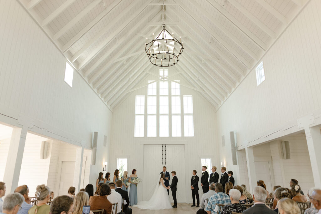 Married couple celebrating their romantic summer wedding at Redeemed Farm