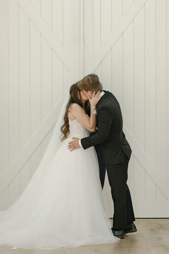 Married couple celebrating their romantic summer wedding at Redeemed Farm