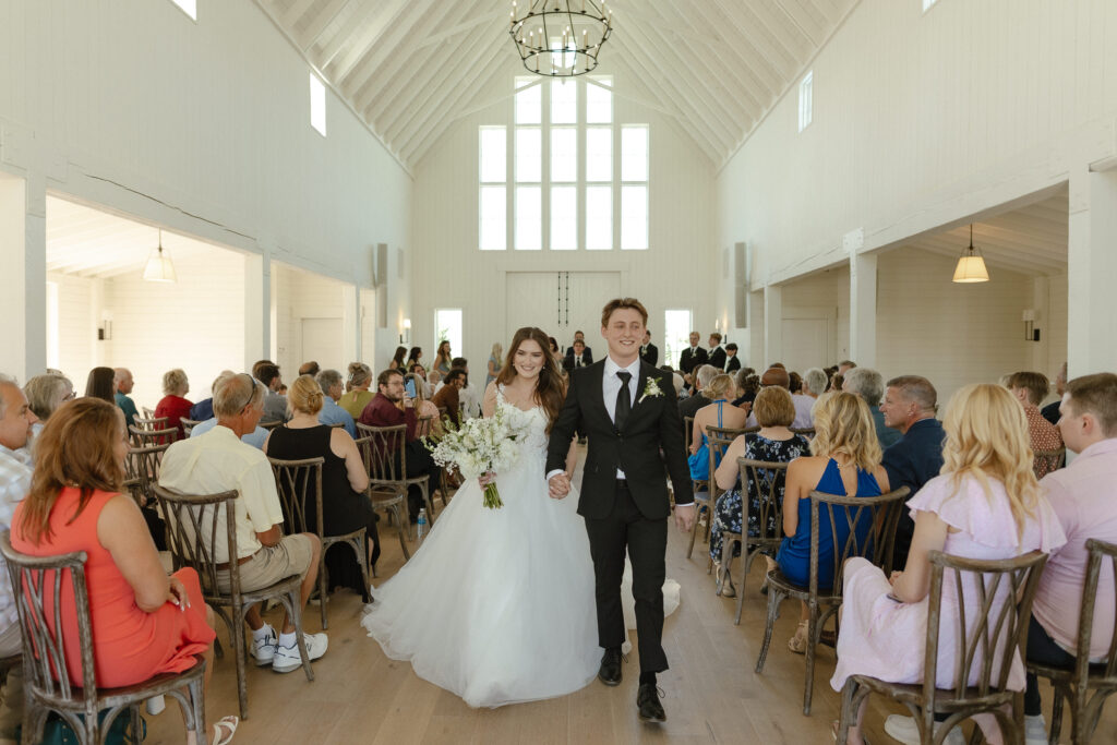 Married couple celebrating their romantic summer wedding at Redeemed Farm