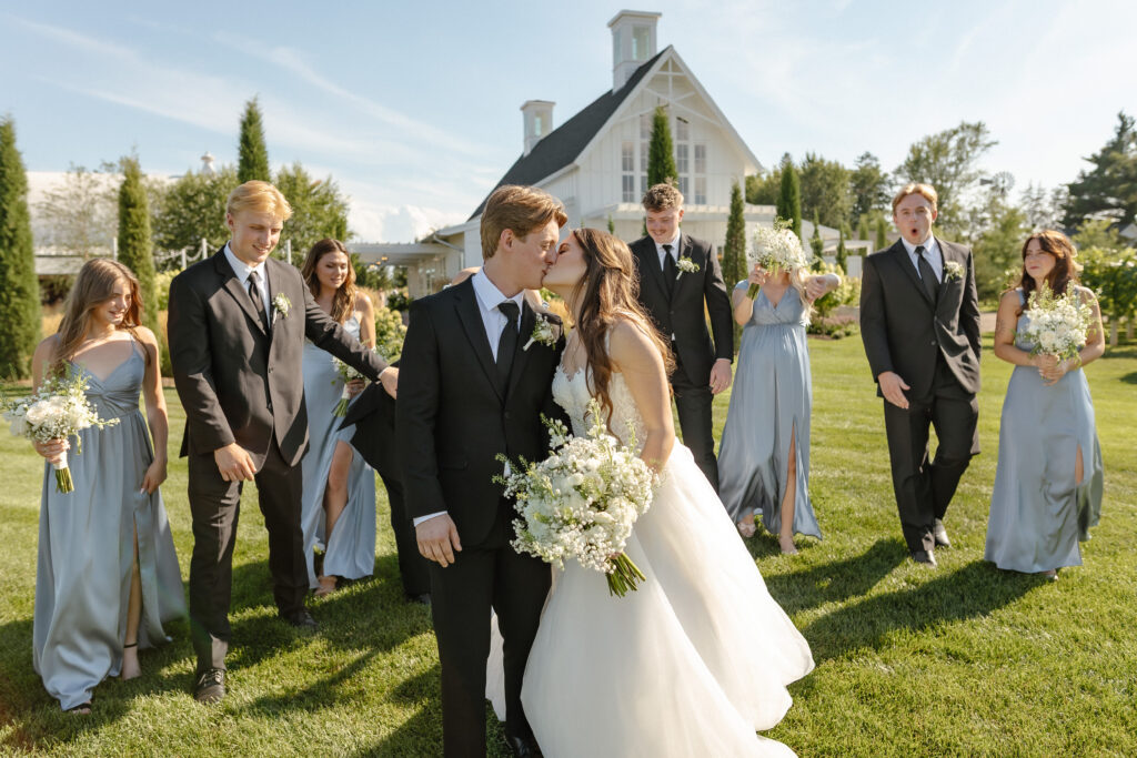 Married couple celebrating their romantic summer wedding at Redeemed Farm