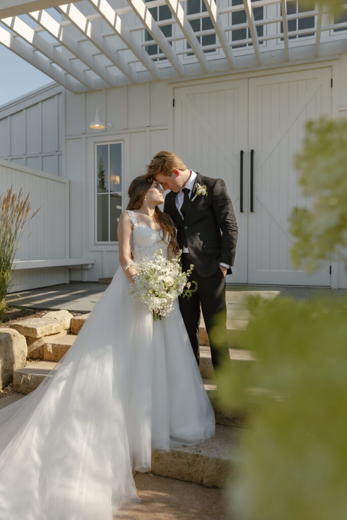 Married couple celebrating their romantic summer wedding at Redeemed Farm