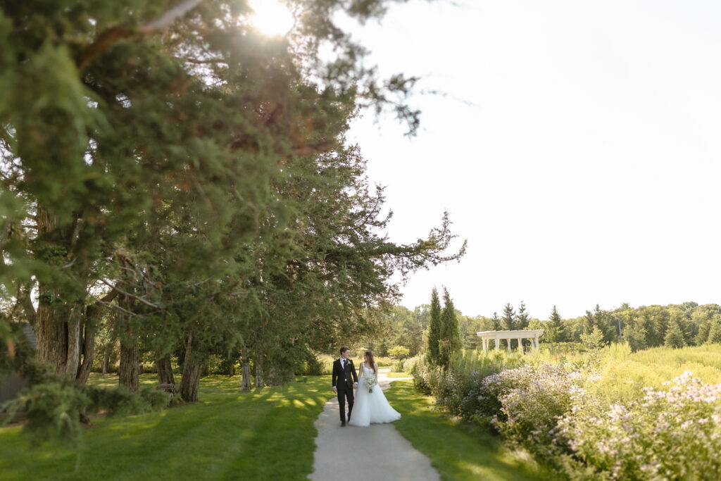 Married couple celebrating their romantic summer wedding at Redeemed Farm