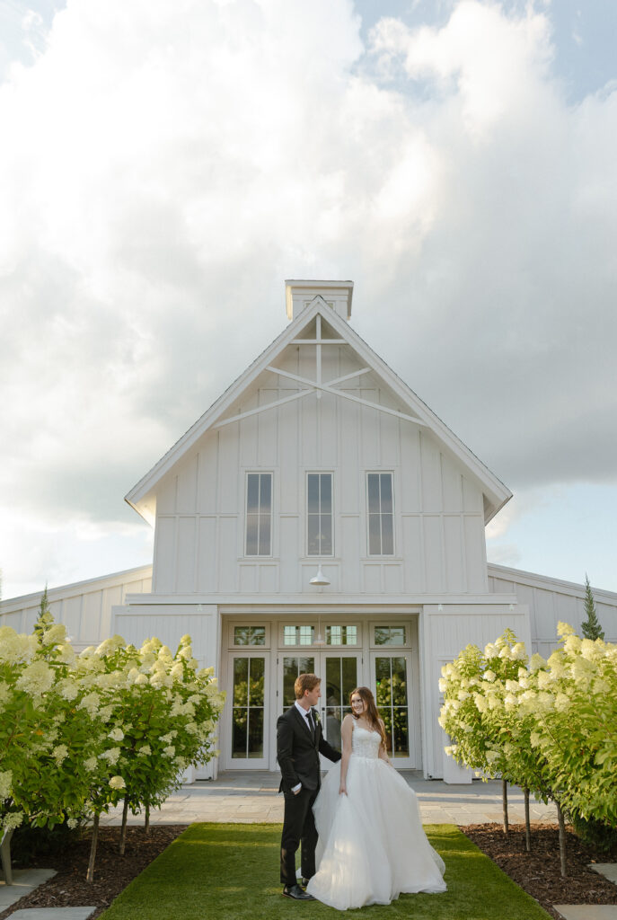 Married couple celebrating their romantic summer wedding at Redeemed Farm
