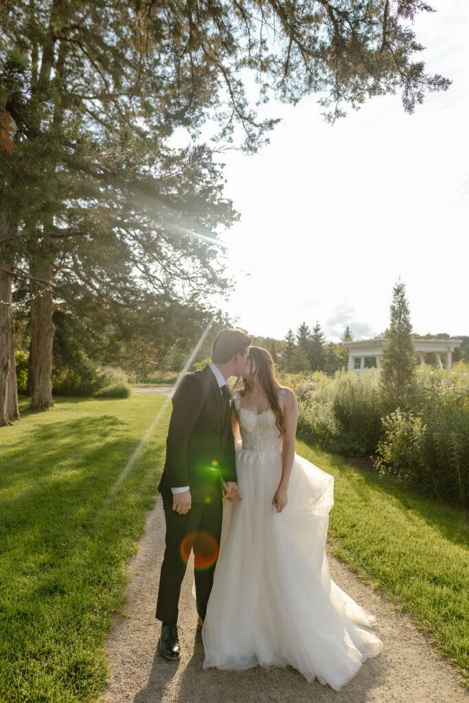 Married couple celebrating their romantic summer wedding at Redeemed Farm